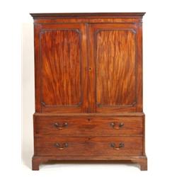 A George III Mahogany Linen Press, the Greek key cornice above a pair of panelled doors, enclosin...