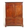 Image 1 : A George III Mahogany Linen Press, the Greek key cornice above a pair of panelled doors, enclosin...