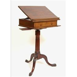 A Late 18th Century Mahogany Reading Table, the top on a rachet support, above a frieze drawer, w...