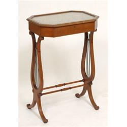 An Edwardian Inlaid Mahogany Table Vitrine, the octagonal top on lyre end supports, joined by tur...