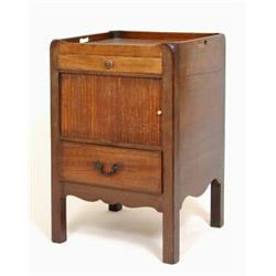 A George III Mahogany Tray Top Night Commode, having a drawer above a tambour slide, with a furth...