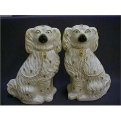 A PAIR OF LARGE STAFFORDSHIRE FLATBACK SPANIELS, 19th Century, white with gilt collar, chains and...