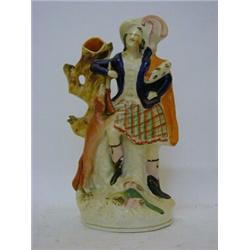 A STAFFORDSHIRE FLATBACK SPILL VASE, 19th Century, Highlander, height 38cm  £50-60...