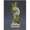 Image 1 : A DERBY FIGURE, c.1825, girl with keep net and fish in the folds of her drapery, on glaze enamels...