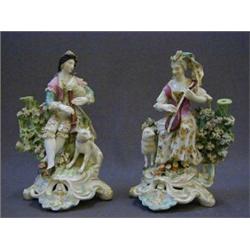 A PAIR OF CHELSEA-DERBY FIGURES, c.1770, lady playing a guitar with sheep, gentleman with musette...