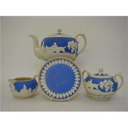 A COPELAND SPODE STONEWARE TEA SET, late 19th Century, relief hunting subjects on a matt sky blue...