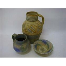 A DENBY 'PASTEL BLUE' JUG AND BOWL, and a 'Folkweave' jug, heights 16cm, 8cm and 32cm (s.d.) (3) ...