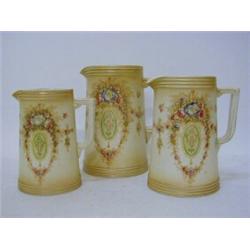 A SERIES OF THREE GRADUATING CROWN DEVON JUGS, 'Lune' pattern, height of tallest 20cm (3)  £50-70...