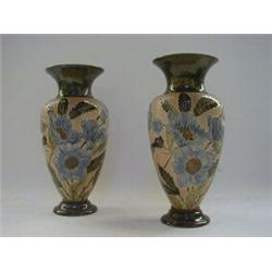 A PAIR OF DOULTON SLATERS PATENT BALUSTER VASES, c.1900, tube-lined floral design on a textured g...