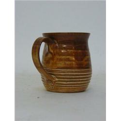 STUDIO OF BERNARD LEACH, a small jug, chocolate glazes, impressed mark to base of handle, height ...