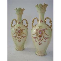 A PAIR OF CROWN DEVON TWIN HANDLED BALUSTER VASES, floral swags, Rd. No. 524189, height 32cm (bot...