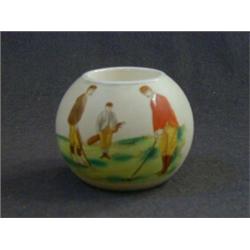 A CARLTONWARE GOLFING COMMEMORATIVE MATCH HOLDER, c.1890, transfer printed and over-painted golfe...