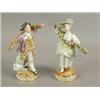 Image 1 : A pair of Meissen figures of a man and a woman each holding floral garlands, on circular bases...