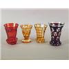 Image 1 : Four mid 19th century Bohemian beakers, comprising: a red overlay floral beaker, with engraved...