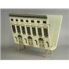 Image 1 : A Fornasetti magazine stand, decorated with classical building fascades, papier mache and bras...