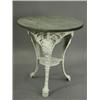 Image 1 : A cast iron garden table with Britannia on paw feet below a wooden top, 60cm diameter Est....