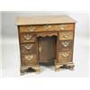 Image 1 : A George III mahogany kneehole desk, the moulded edge top with re-entrant corners, over seven...