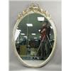Image 1 : A late 19th century oval wall mirror, the silvered and gilded gesso frame with ribbon cresting...
