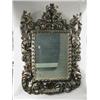 Image 1 : An early 18th century North Italian stained limewood wall mirror, profusely and intricately ca...