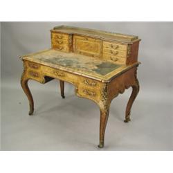 A good Victorian walnut veneered desk, with tulipwood mouldings, inlaid stinging, crossbanding...