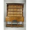 Image 1 : A late 18th century oak pot board dresser, the plate rack with three open shelves below a moul...