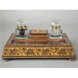 A 19th century Tunbridge ware desk stand, supported upon squat bun feet, 25.5cm wide (some splits...
