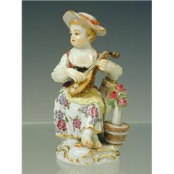 A Meissen figure of a seated girl playing a lute, crossed swords mark, incised and impressed numb...