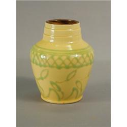 A Royal Doulton bulbous vase with a yellow ground glaze and green tubed decoration, circa 1930, i...