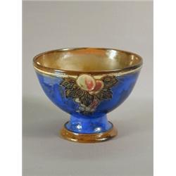A Royal Doulton stoneware vase, with tubed leaf and fruit decoration, stamped marks and numbered...