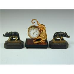 A late 19th century clock with an enamelled dial and French movement mounted on a gilded bronze e...