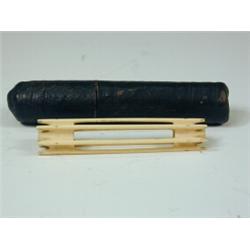 A George III ivory thread winder in a tooled leather case, 10cm long Est. 100/150...