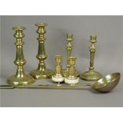 Three pairs of candlesticks; a pair of antique brass sticks with candle ejectors; a pair of class...
