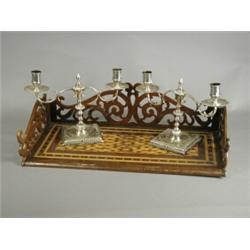 A pair of plated twin branch candelabrum, with weighted bases, and a marquetry book stand with op...