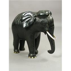 A large 19th century carved figure of an elephant, 51cm high Est. 150/180...