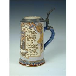 A Mettlach pewter mounted beer stein, with a tavern type scene and verse, impressed marks to unde...