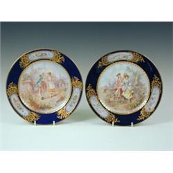 A pair of 19th century Sevres style porcelain cabinet plates decorated with courting scenes, sign...