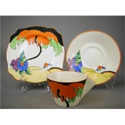 A Clarice Cliff 'Woodland' pattern trio, printed and impressed marks to the underside (very fine...