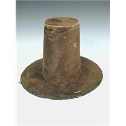 A traditional Welsh tall hat, of black beaver, late 19th century, distressed condition, 24cm high...