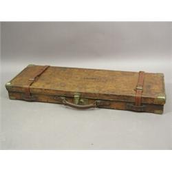 A leather shotgun case with brass corners with embossed inscription C.G. Campbell/Jura, to the li...