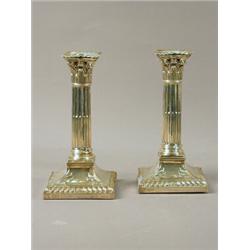 A pair of Edwardian silver candlesticks of classical column form on weighted bases, Hawksworth, E...