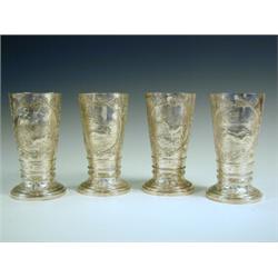 A set of four Victorian coursing beakers, embossed and chased with acorn and leaf decoration, eac...