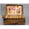 Image 1 : A crocodile skin dressing case, the fitted interior with enamel backed and silver items (some mis...