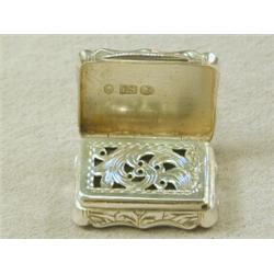 A small Victorian silver vinaigrette, with engraved decoration and serpentine outline Est. 80/120...