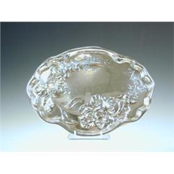 An Art Nouveau silver dressing table tray repousse decorated with flowers, by Williams (Birmingha...