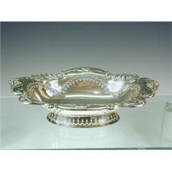 An Edwardian oval silver bread basket with embossed and pierced decoration Elkington & Co, 1904,...