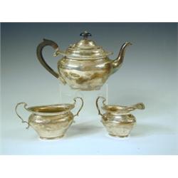 An Edwardian Mappin & Webb silver three piece bachelors tea set, Birmingham...