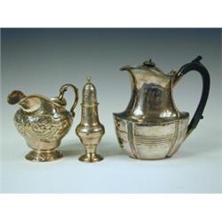 A George III silver cream jug, London 1816, maker T.I. (?), and a Victorian silver hot water jug,...