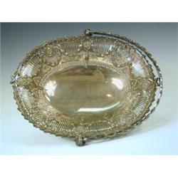An Elkington & Co silver plated basket, embossed with floral medallions and bellflower swags, 34c...