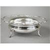 Image 1 : A late George V silver fruit bowl with an applied 'C' scroll rim, supported upon four paw feet, S...