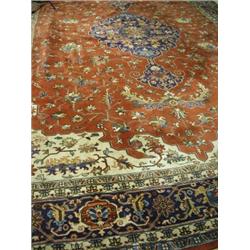 A large Bokhara rug with a central medallion and stylised flowers on a red field Est. 1200/1500...